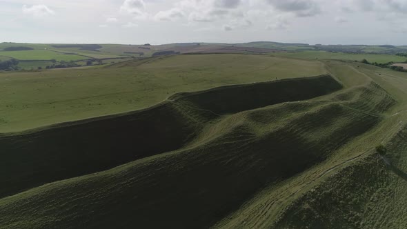 Aerial tracking along the northern side of the iron age hill fort known as Maiden Castle. Three leve