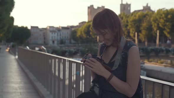 A Beautiful Woman Tourist Walks Through the Historical Center of the French City of Narbonne