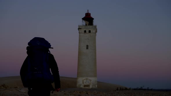 Hiker Walking To Rubjerg Knude Lighthouse