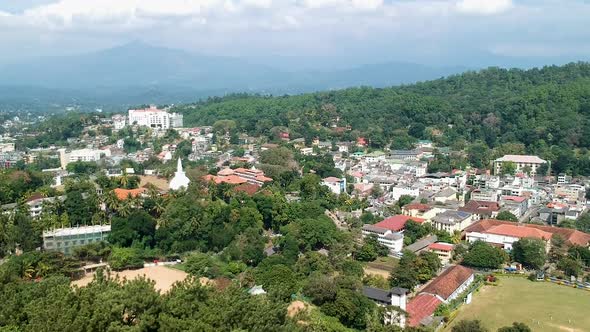 Aerial of Kandy city with mountains and Kandy lake. Sri Lanka