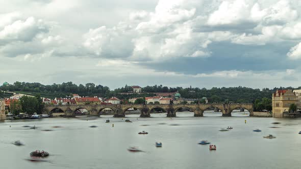 View of the City Prague in Czech Republic with Colorful Paddle Boats Timelapse on the Vltava River