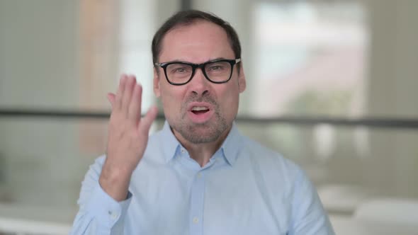 Portrait of Angry Middle Aged Man Fighting Arguing