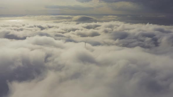 Aerial View of the Upper Part of the Broadcasting Tower in the Fog