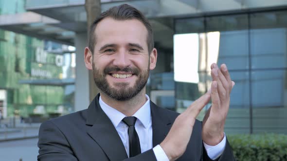 Applauding Successful Businessman Clapping