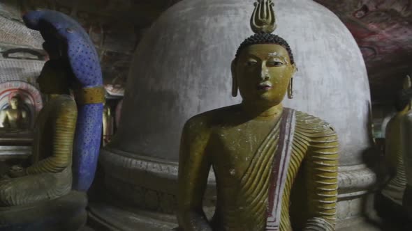 DAMBULLA, SRI LANKA - FEBRUARY 2014: Sitting Buddhas at the Golden Temple of Dambulla. The Golden Te