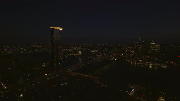 Aerial Panoramic Night Shot of One Manhattan Square Apartment Building with Illuminated Rooftop and