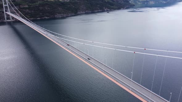 Looking down at Norways largest suspension bridge in Hardanger - High altitude aerial over bridge wi