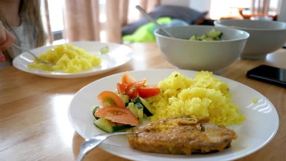 Turmeric Pilau Rice Dish Served Salad Sliced Tomato and Cucumber Slices