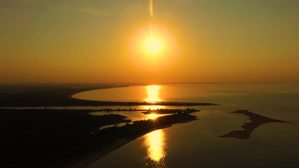 Aerial view over the delta of the Vistula to the Baltic Sea at sunse. Mikoszewo, Jantar