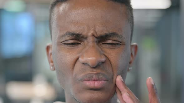Close up of African Man having Toothache