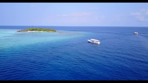 Aerial drone panorama of paradise coastline beach holiday by blue green ocean and white sandy backgr