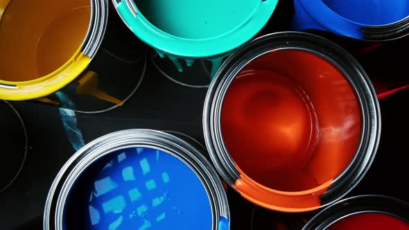 Aluminium Cans with Vivid, Colorful Paint Inside Stacked on the Floor of a Warehouse. Top View