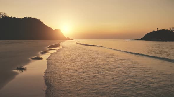 Sunset at Ocean Waves Wash Sand Beach