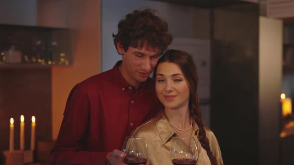 Couple Enjoying Romantic Evening at Home with Wine