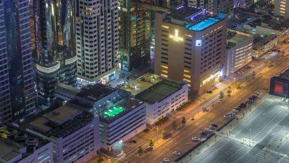 Car Parking Lot with Rooftop Swimming Pool Viewed From Above Night Timelapse Aerial Top View