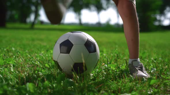 Closeup Kid Legs Doing Football Tricks