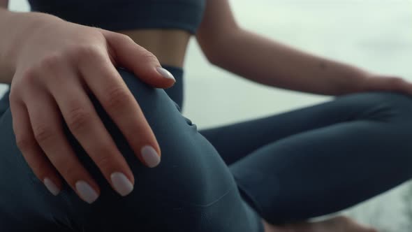 Woman Hands Lying Feet in Lotus Pose Close Up