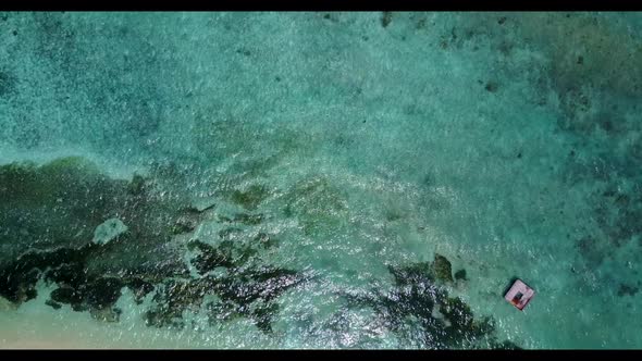 Aerial top view texture of tropical coastline beach holiday by turquoise water and white sand backgr