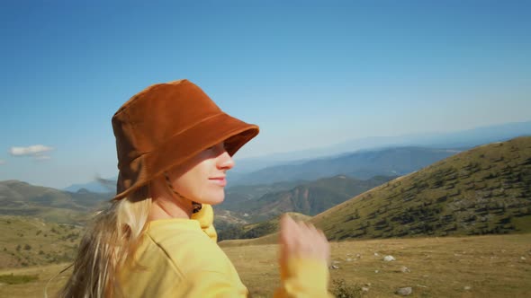 Portrait of Smiling Happy Young Woman in Nature