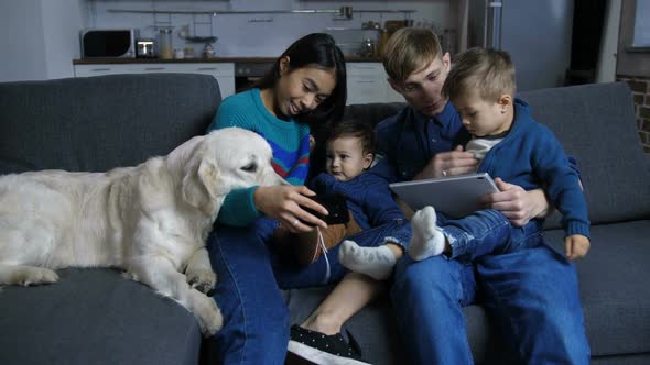 Modern Family with Pet Enjoying Leisure at Home