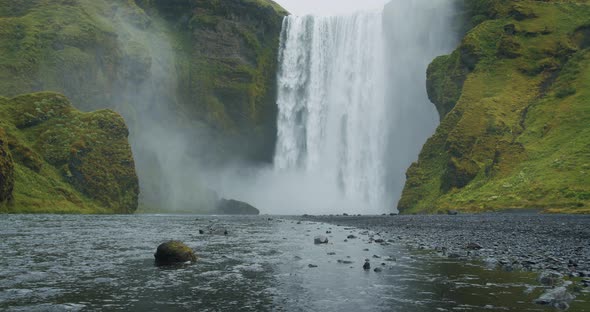 Beautiful Skogafoss Waterfall with River Reflection in Iceland