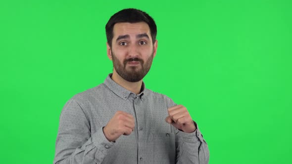 Portrait of Brunette Guy Is Dancing Funny. Green Screen