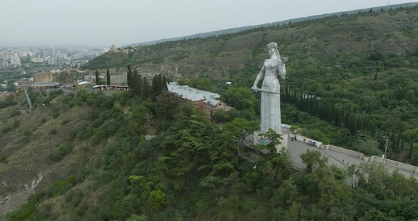 Tilt up aerial shot of a famous Mother of Georgia (Kartlis Deda) monument.