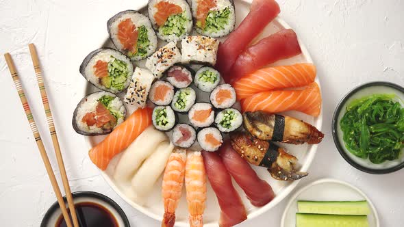 Various Sushi Rolls Placed on Round Ceramic Plate