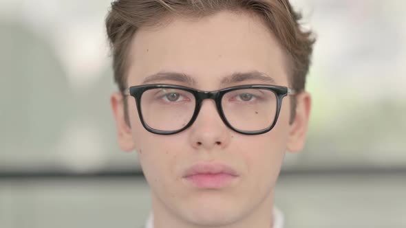 Close Up of Young Man Looking at the Camera