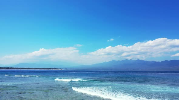 Aerial top view tourism of luxury coastline beach wildlife by blue green lagoon with white sand back