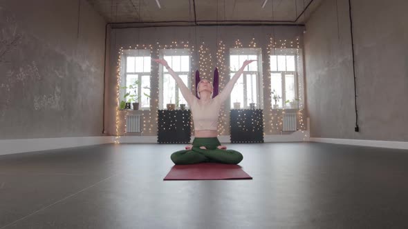 Yoga Indoors  Blonde Woman Meditating in Empty Studio