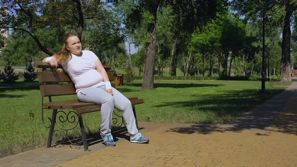 Fat Girl Exhausted After Jogging Takes Minute Rest on Bench, Combating Obesity