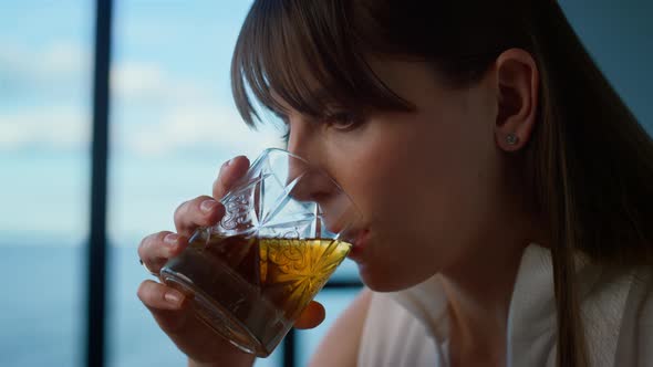 Office Manager Drinking Whiskey Closeup