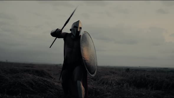 Shirtless Spartan Training in Dry Field