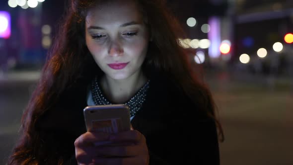 Portrait of young beautiful caucasian long brown hair woman using smart phone