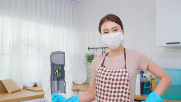 Portrait of Asian young cleaning service woman worker working in house.