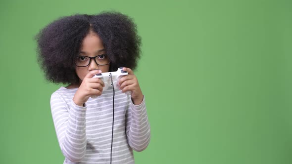 Young Cute African Girl with Afro Hair Playing Games