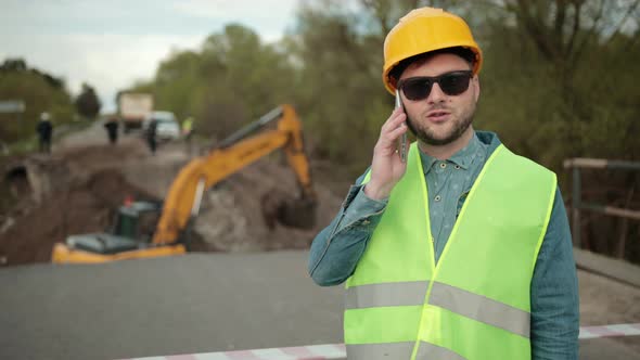 Portrait of an Engineer Talking on the Phone