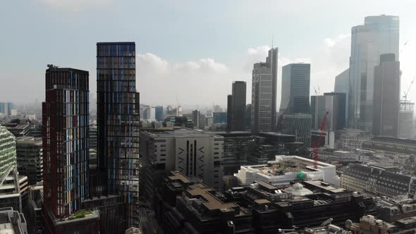 Reverse aerial view of Liverpool Street Station and Broadgate on a hazy sunny day in London