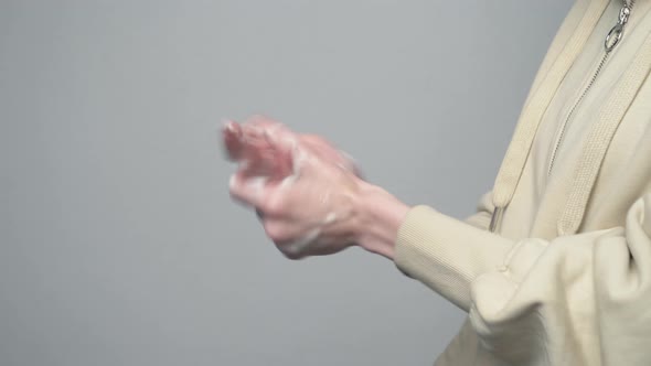 woman washing up a hands with disinfection gel