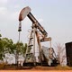 old pumpjack pumping crude oil from oil well, timelapse - VideoHive Item for Sale