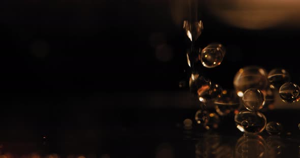 Hydrophobic Fluid Dropped into Water in Slow-Motion