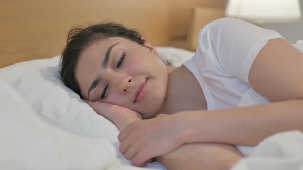 Young Indian Woman Sleeping in Bed Peacefully