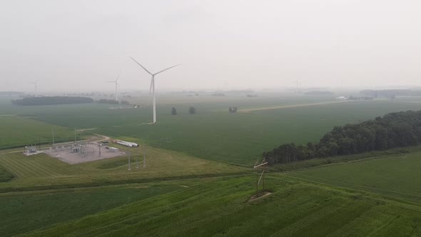 Windmill Within DTE Wind Farm During White Cloudy Day In Ithaca, Gratiot County, Michigan. wide shot