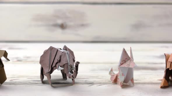 Set of Origami Animals on Wooden Background.