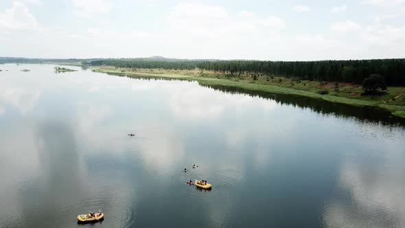 Orbital drone view of rafting boats on the beautiful Nile River in Jinja, Uganda.