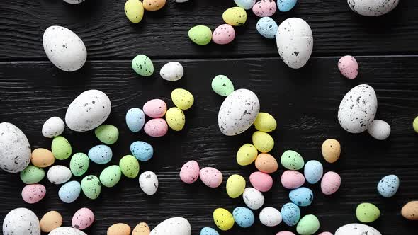 Easter Holidays Concept. Colorful Different Kinds of Eggs Placed on Black Wood