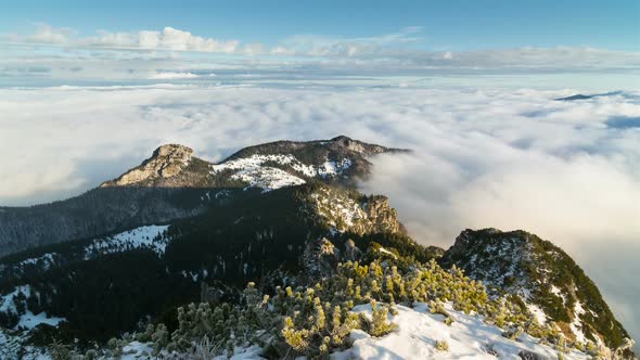 Sunny Winter Morning Above Clouds in Foggy Mountains