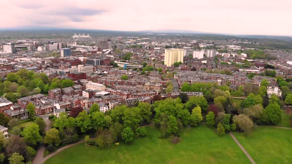 Flying over Avenham Park towards Preston city centre on a cloudy day