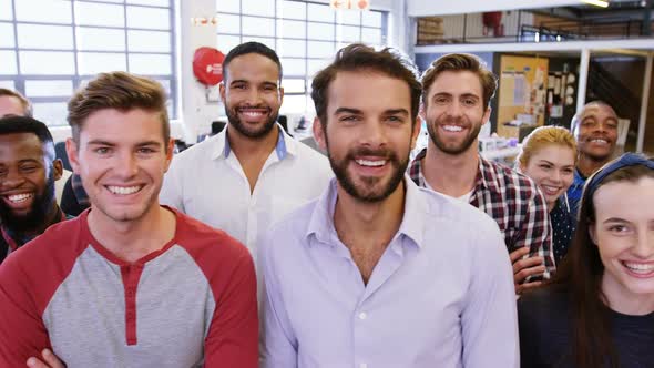 Portrait of business team standing together in office